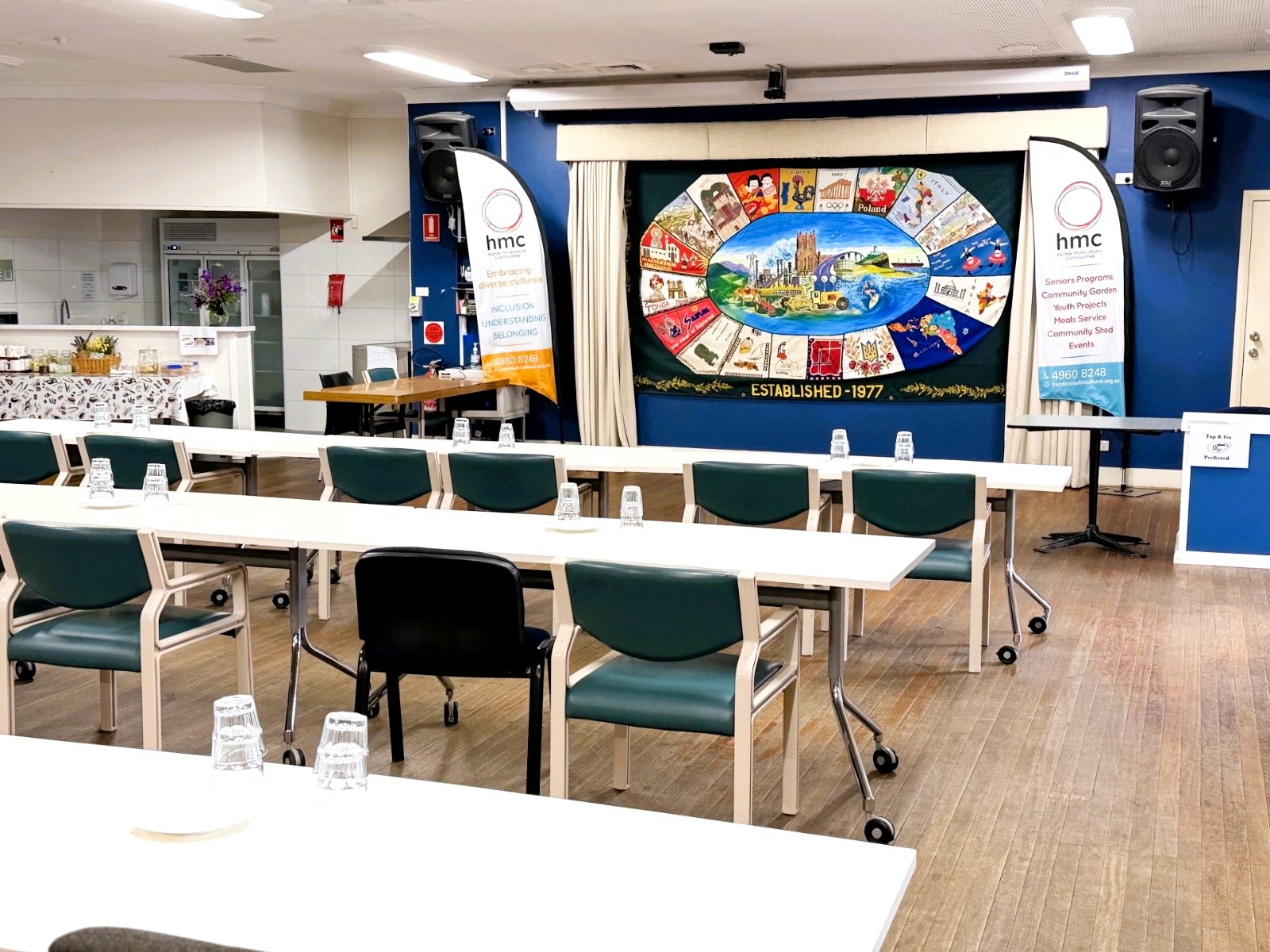HMC hall set up with tables and chairs
